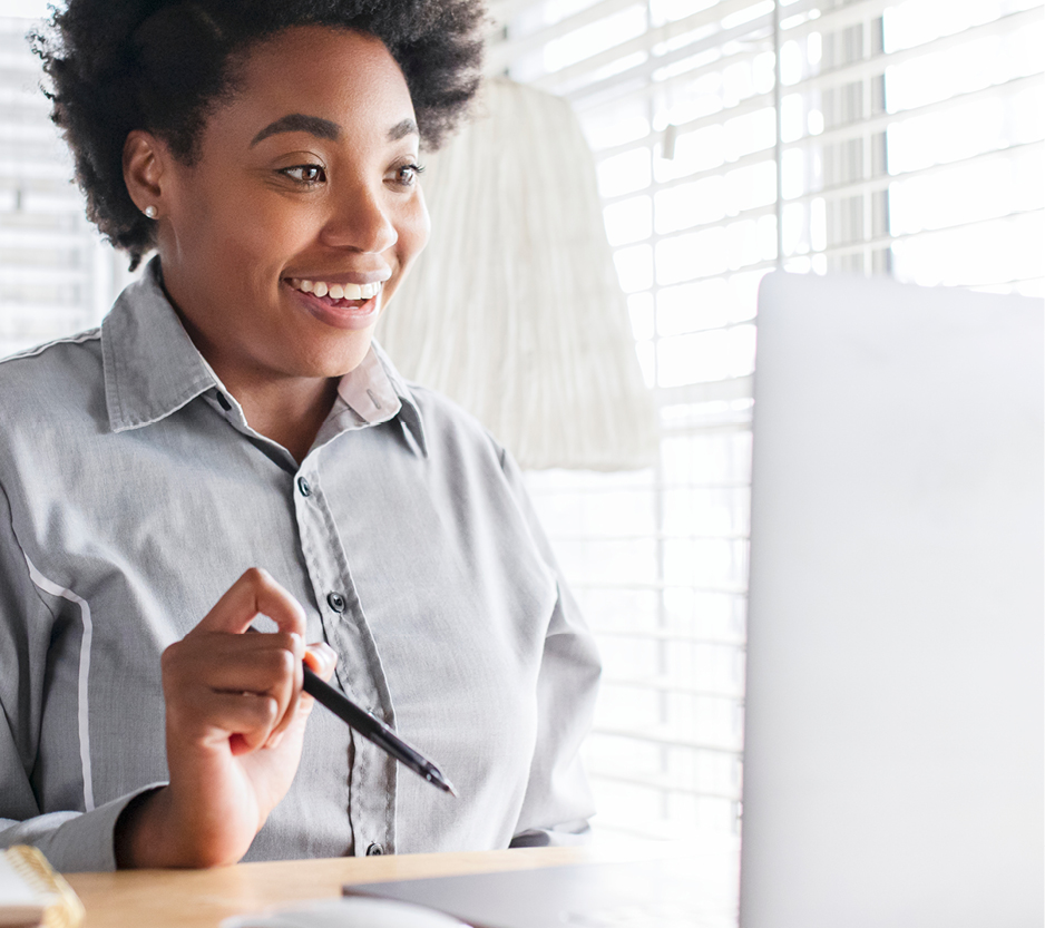 photo of a woman working at her laptop